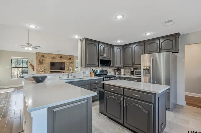 a utility room with sink dryer and washer