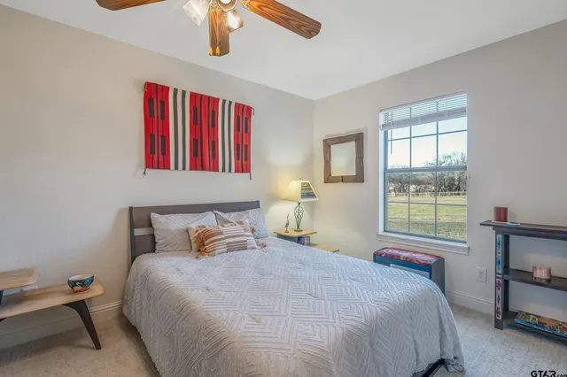 a bedroom with a bed and window