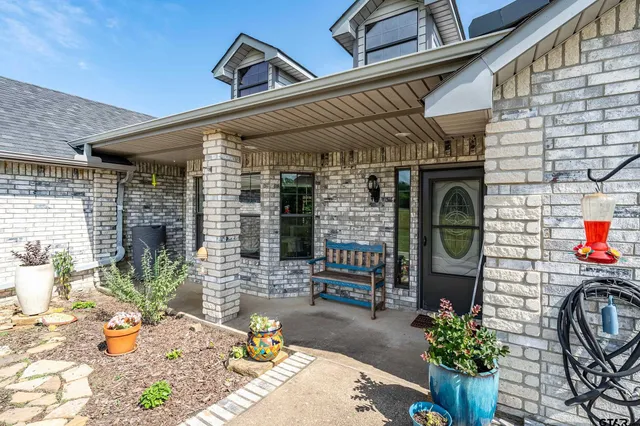 a front view of a house with patio