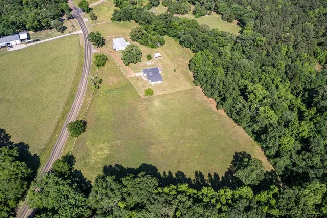an aerial view of residential house with outdoor space