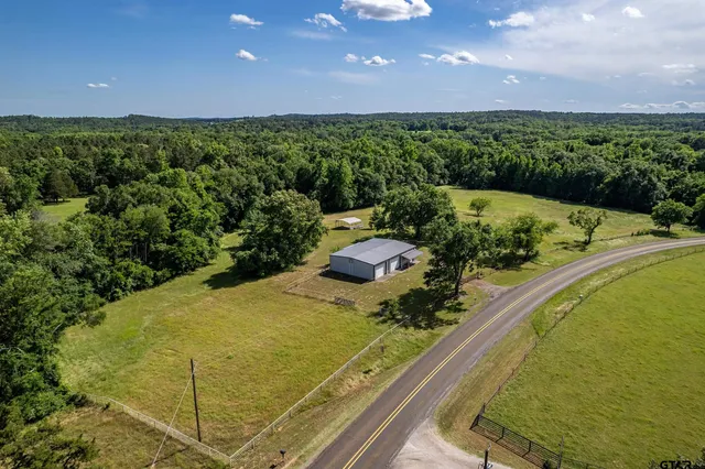 a view of a swimming pool and an outdoor seating