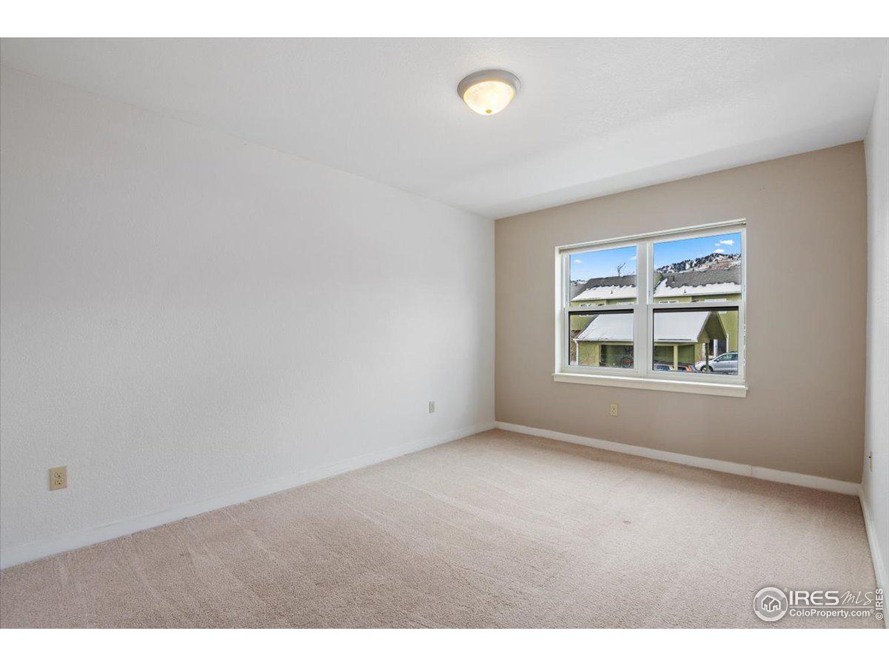 4625 16th Street, Unit 4 Boulder, CO 80304 - Photo 8 of 11 a view of an empty room with window