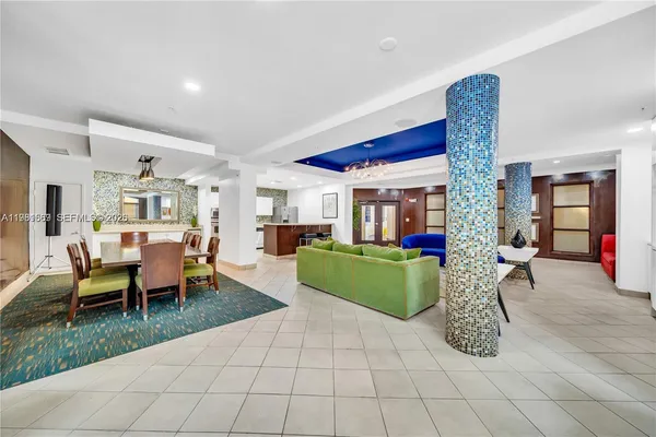 a lobby with furniture and dining area