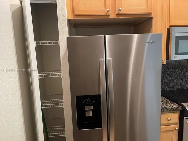 a stove top oven sitting inside of a kitchen