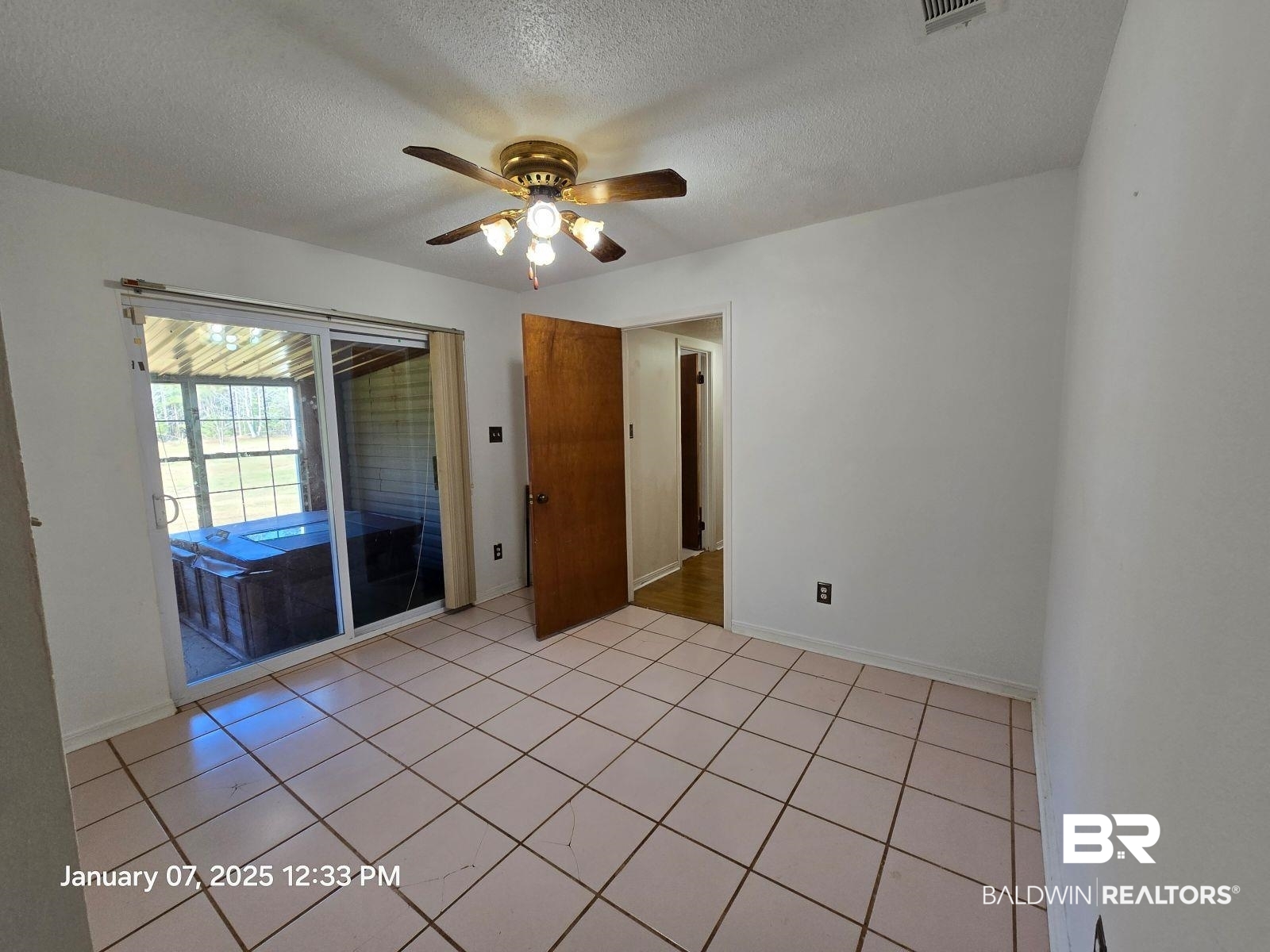 154 Byrd Road Monroeville, AL 36460 - Photo 9 of 26 Tiled spare room featuring ceiling fan and a textured ceiling