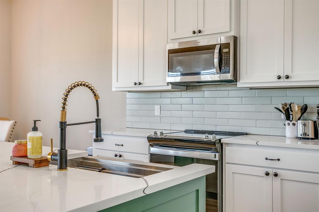920 Kite Road Mineral Wells, TX 76067 - Photo 12 of 30 a kitchen with a sink and a stove top oven