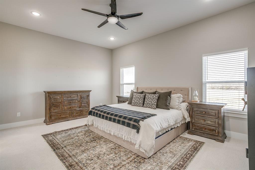 920 Kite Road Mineral Wells, TX 76067 - Photo 14 of 30 a living room with a bed furniture and next to a window
