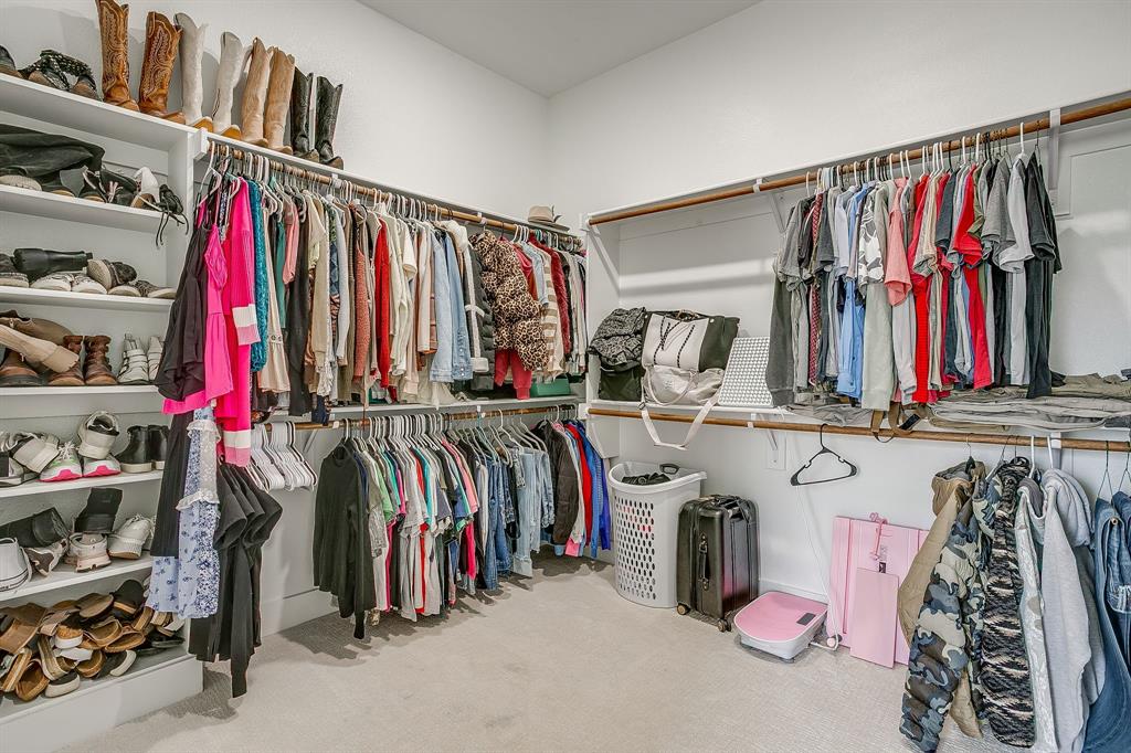 920 Kite Road Mineral Wells, TX 76067 - Photo 19 of 30 a view of walk in closet with clothes