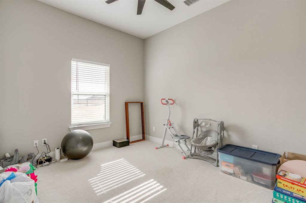 920 Kite Road Mineral Wells, TX 76067 - Photo 21 of 30 a bedroom with furniture and a window