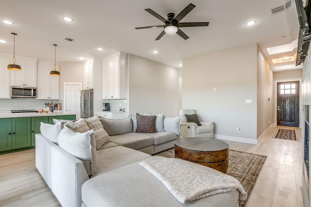 920 Kite Road Mineral Wells, TX 76067 - Photo 9 of 30 a living room with furniture kitchen area and a wooden floor