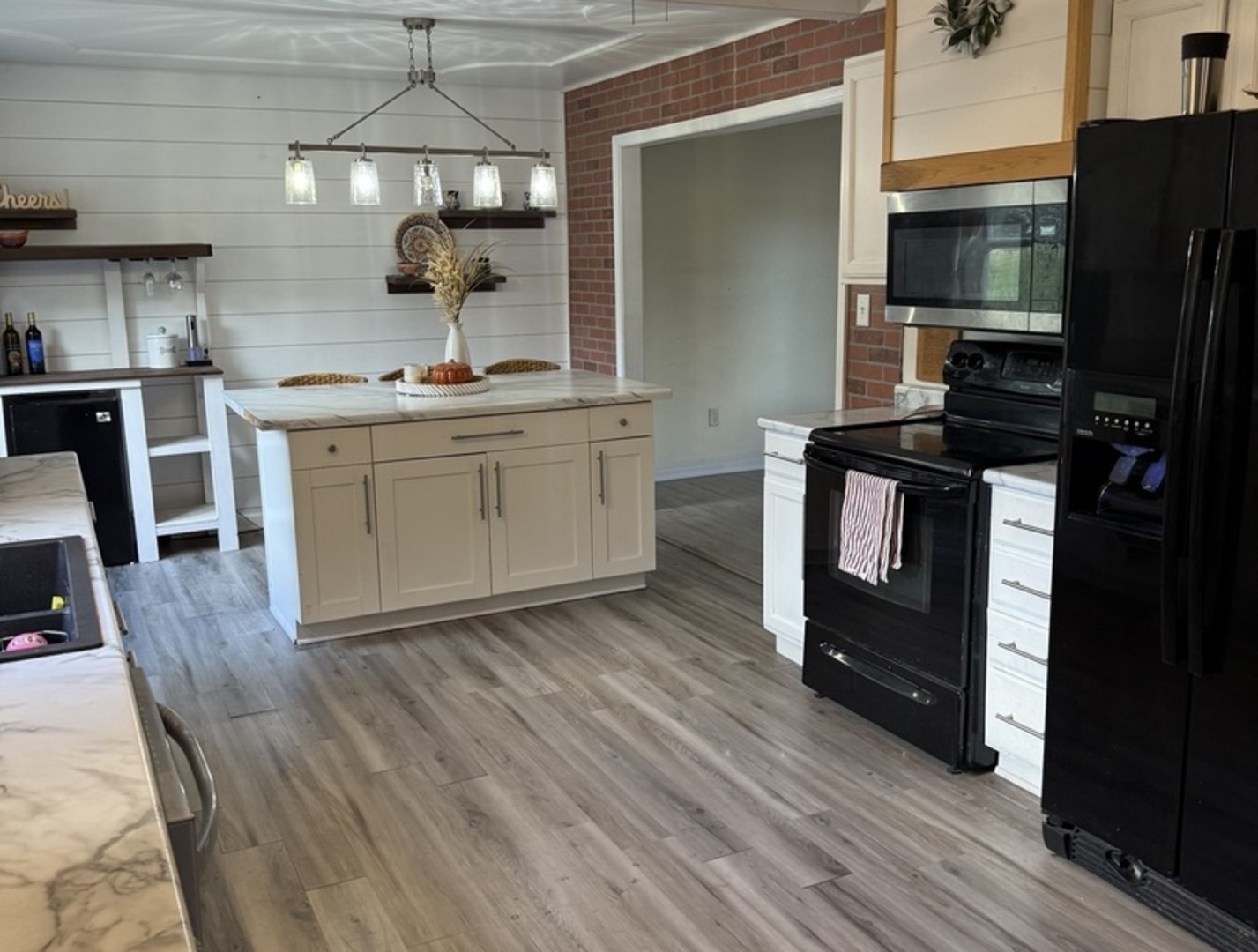 106 Windward Lane Rochelle, IL 61068 - Photo 12 of 42 a kitchen with a sink and a stove top oven