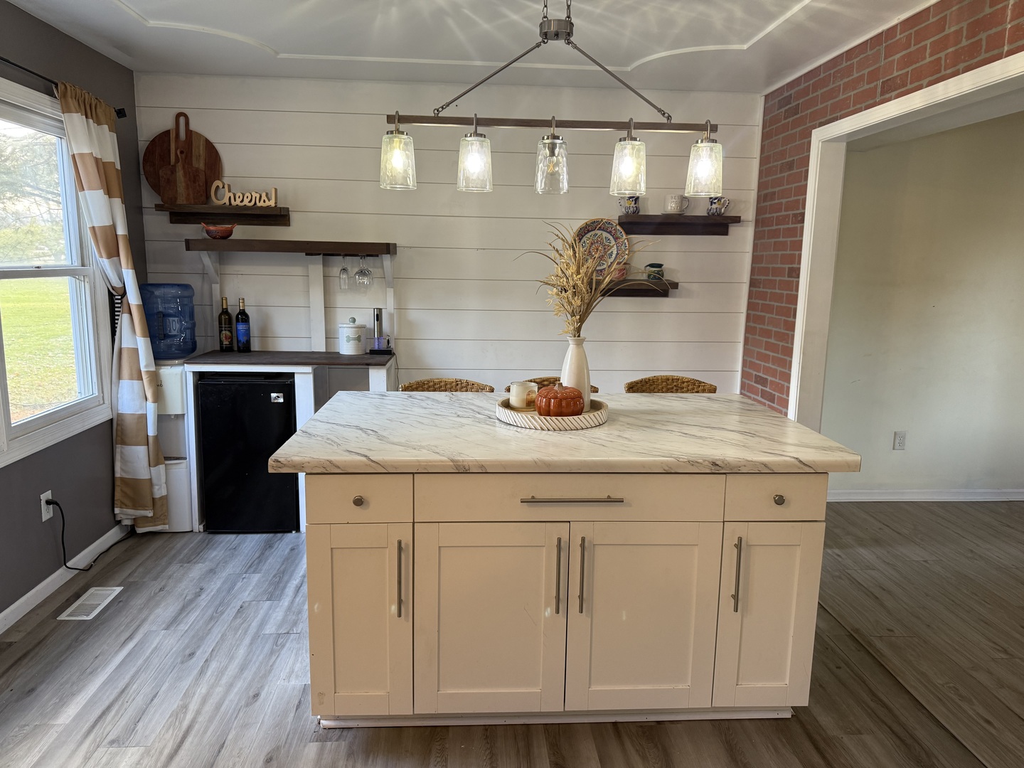 106 Windward Lane Rochelle, IL 61068 - Photo 14 of 42 a kitchen with sink cabinets and wooden floor