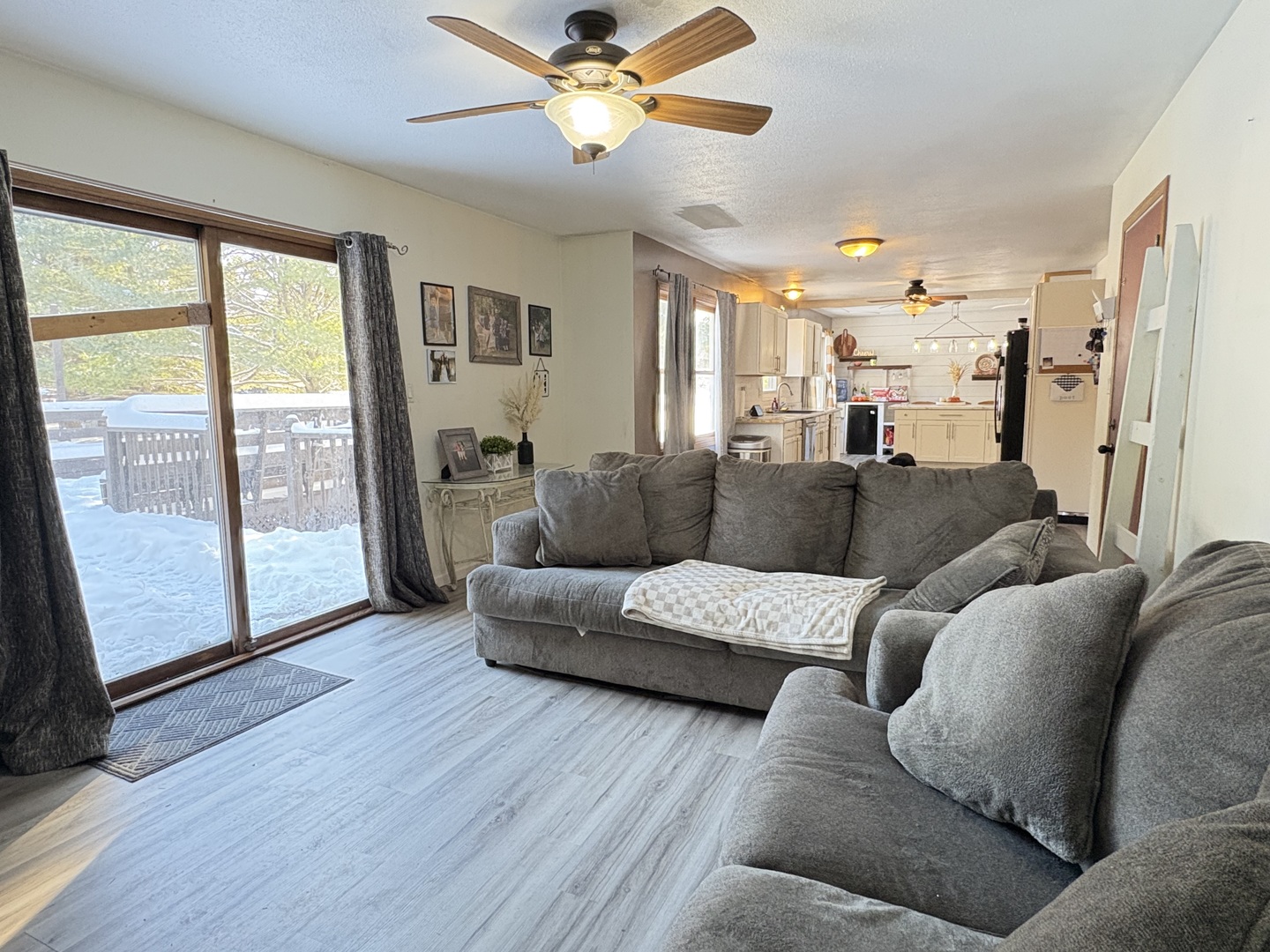 106 Windward Lane Rochelle, IL 61068 - Photo 17 of 42 a living room with furniture and a large window