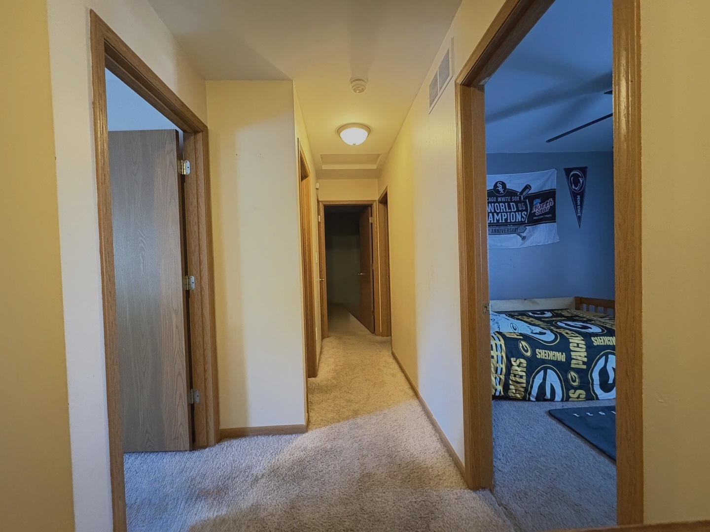 106 Windward Lane Rochelle, IL 61068 - Photo 29 of 42 a view of a hallway with wooden floor and a livingroom