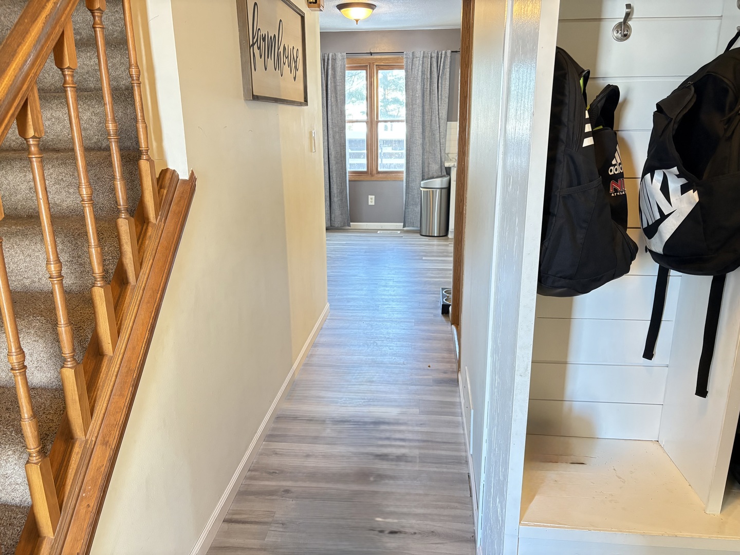 106 Windward Lane Rochelle, IL 61068 - Photo 4 of 42 a view of a hallway with wooden floor and stairs