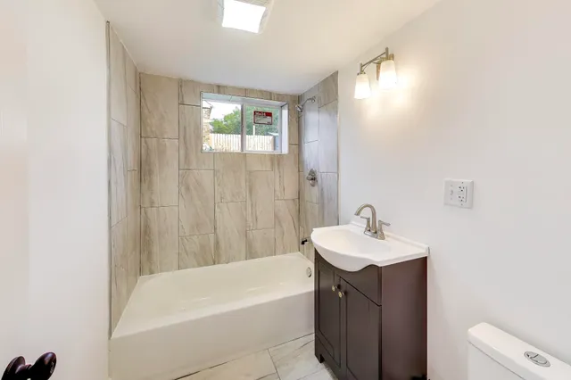 a bathroom with a sink and a bathtub