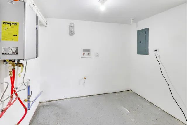 a view of an entryway with wooden floor