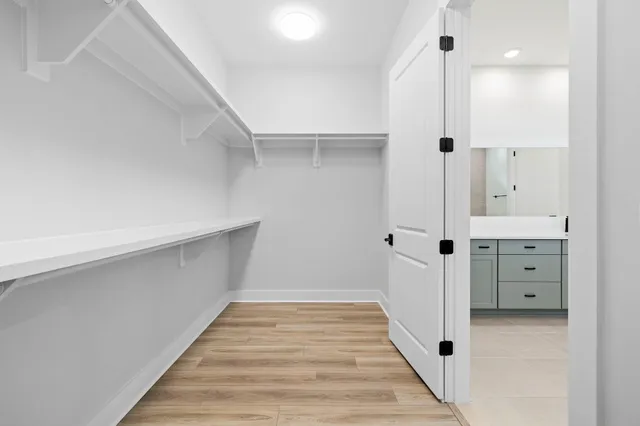 a bathroom with a double vanity sink and mirror