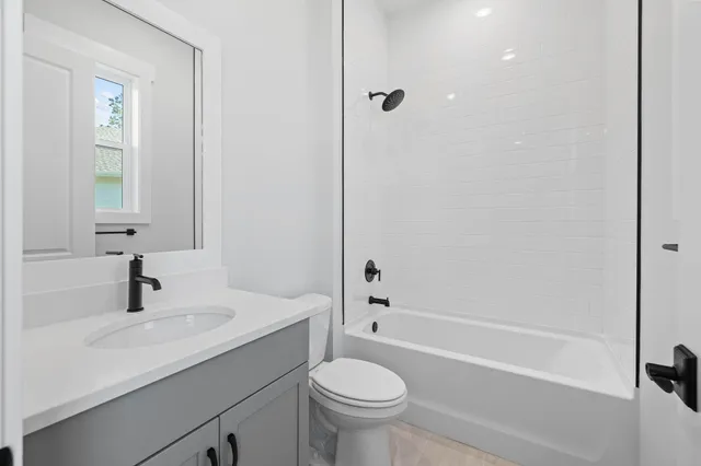 a bathroom with a sink toilet and a bathtub