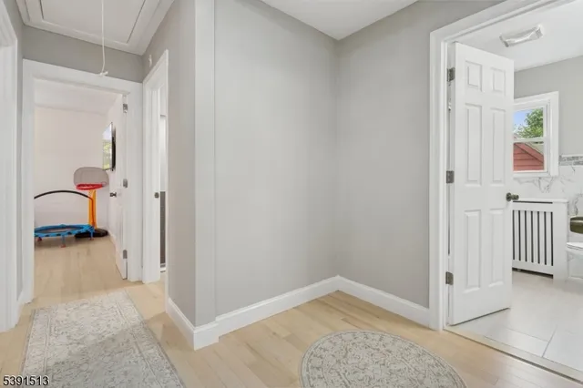 a view of a hallway view with two couch