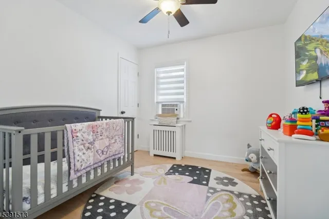 a bedroom with a bed and a baby crib