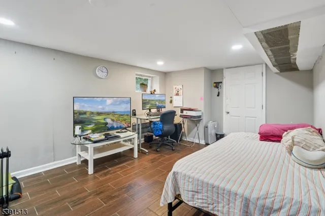 a bedroom with a bed and a chair