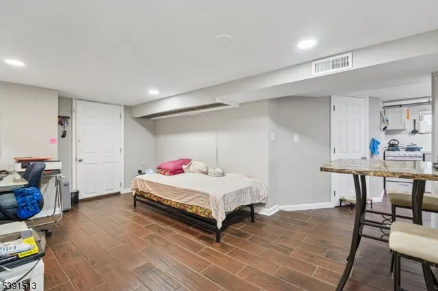 a room with a bed and a table in it