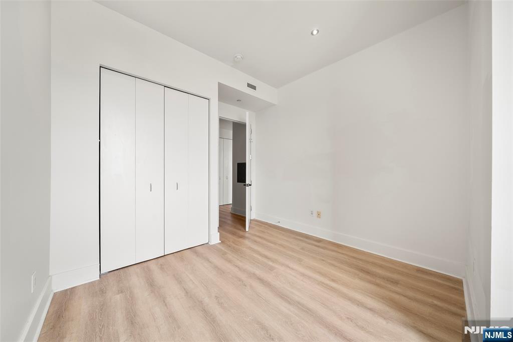 4 Beacon Way, Unit 1407 Jersey City, NJ 07304 - Photo 11 of 19 a view of an empty room
