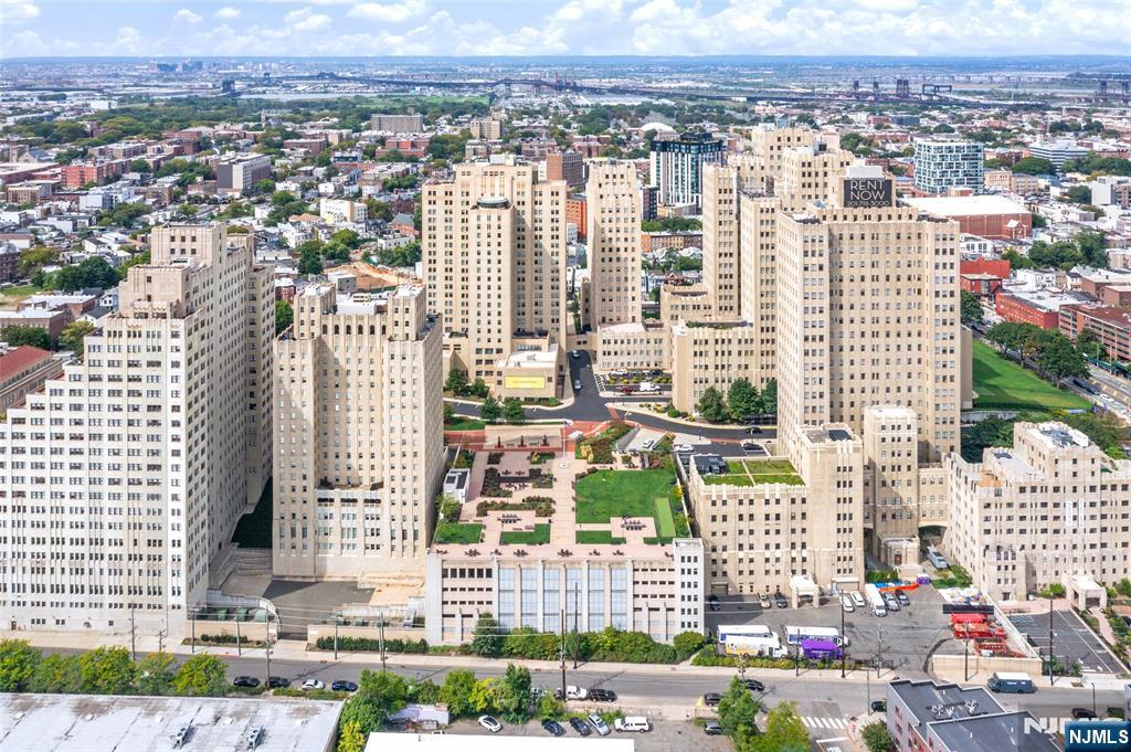4 Beacon Way, Unit 1407 Jersey City, NJ 07304 - Photo 18 of 19 a view of a city with tall buildings