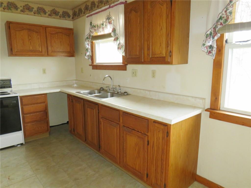 236 Francis Road Pittsburgh, PA 15239 - Photo 11 of 14 a kitchen with a sink cabinets and a window