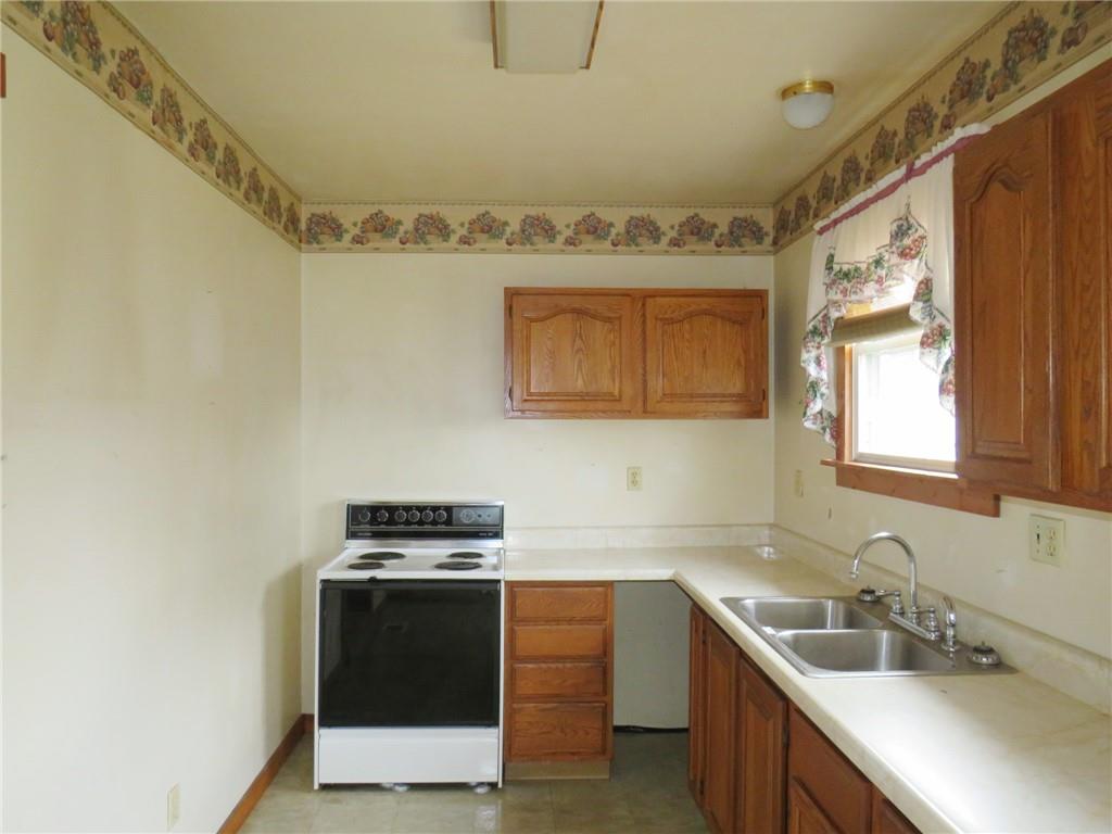 236 Francis Road Pittsburgh, PA 15239 - Photo 10 of 14 a kitchen with a sink stove and microwave