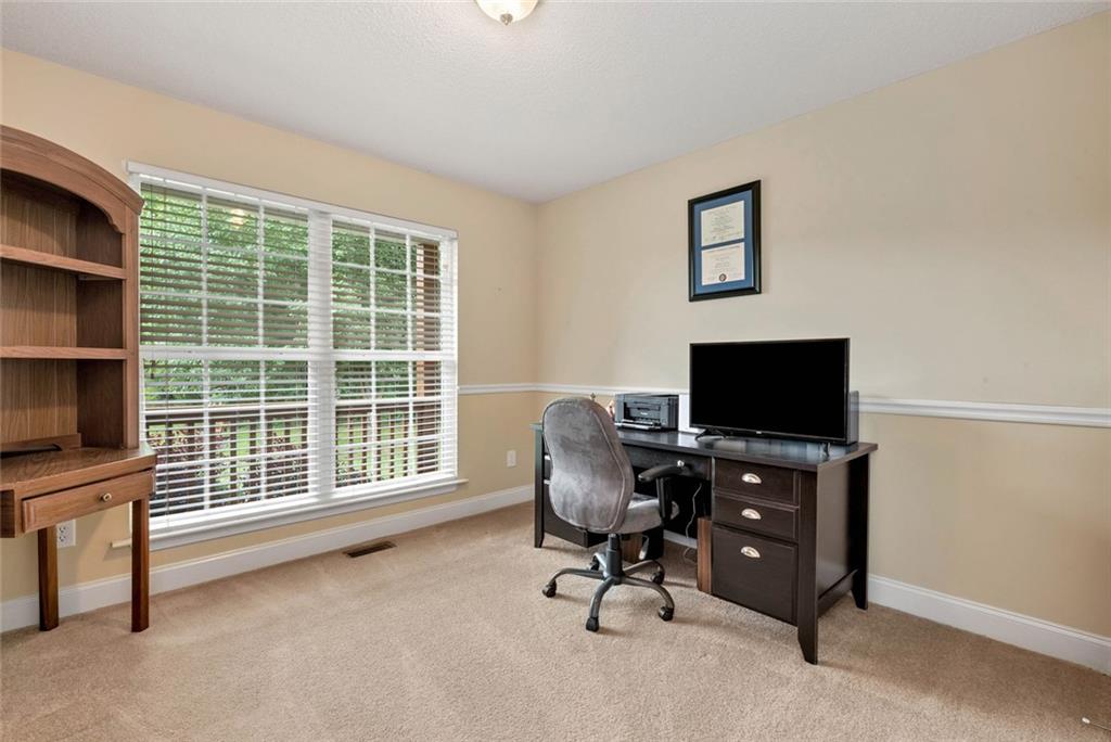 1044 Lothridge Road Cleveland, GA 30528 - Photo 28 of 40 a view of a livingroom with workspace and a window