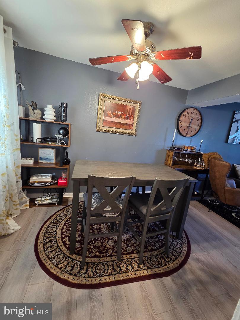 2754 Iverson Street, Unit 72 Temple Hills, MD 20748 - Photo 11 of 17 a living room with furniture and a wooden floor