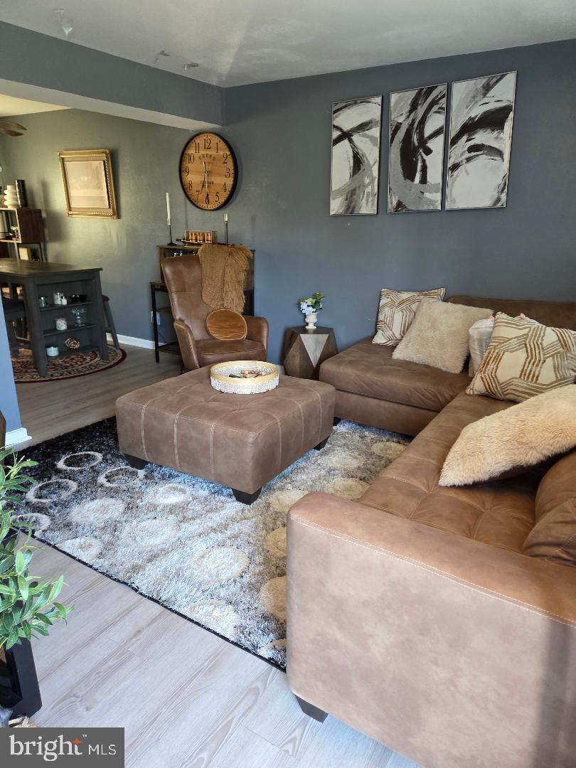 2754 Iverson Street, Unit 72 Temple Hills, MD 20748 - Photo 12 of 17 a living room with furniture and a dresser
