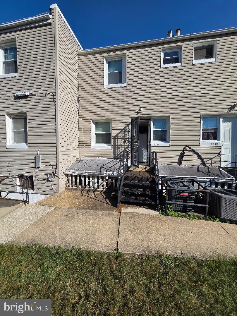 2754 Iverson Street, Unit 72 Temple Hills, MD 20748 - Photo 17 of 17 a view of a chairs and a garage