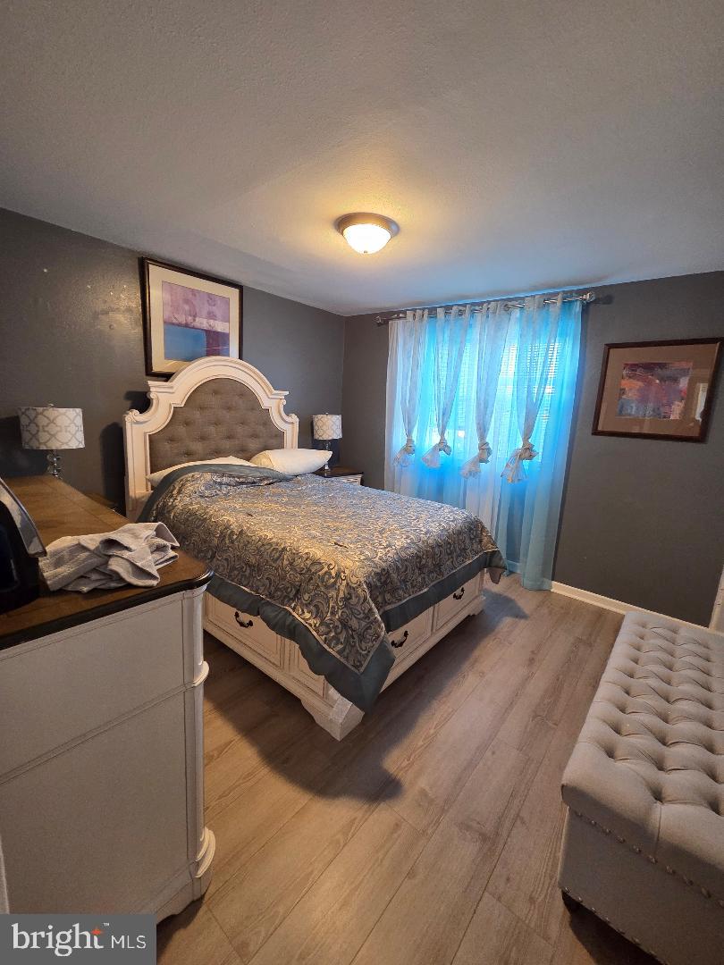 2754 Iverson Street, Unit 72 Temple Hills, MD 20748 - Photo 4 of 17 a bedroom with a bed and window
