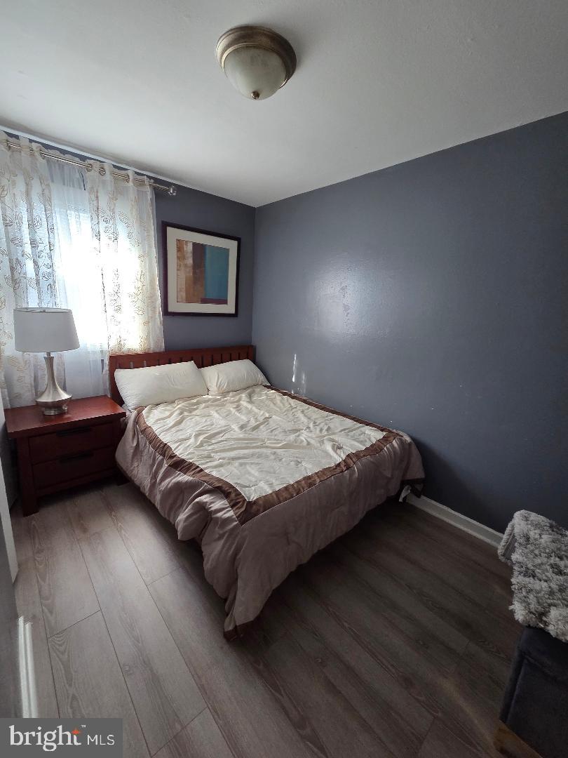 2754 Iverson Street, Unit 72 Temple Hills, MD 20748 - Photo 5 of 17 a bedroom with a bed and a window