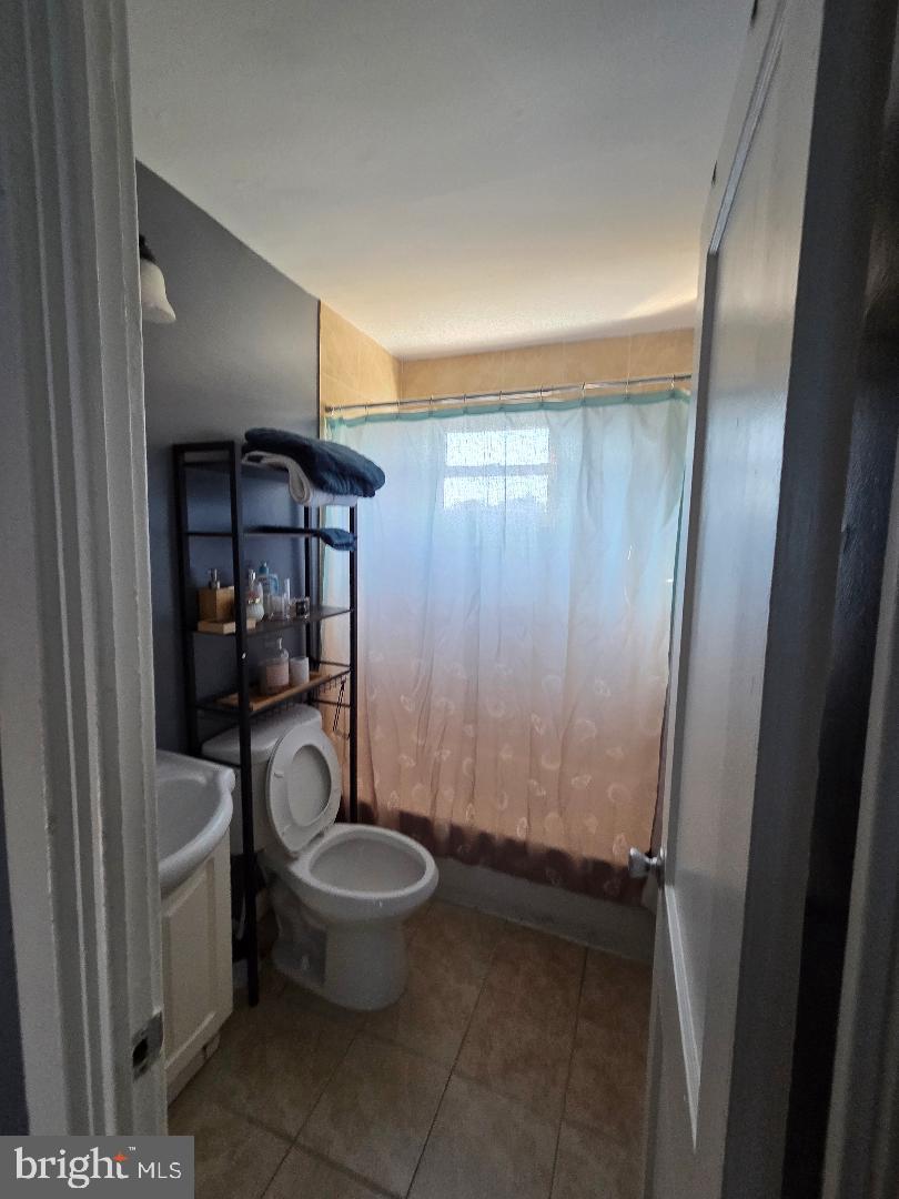 2754 Iverson Street, Unit 72 Temple Hills, MD 20748 - Photo 7 of 17 a bathroom with a toilet and a sink