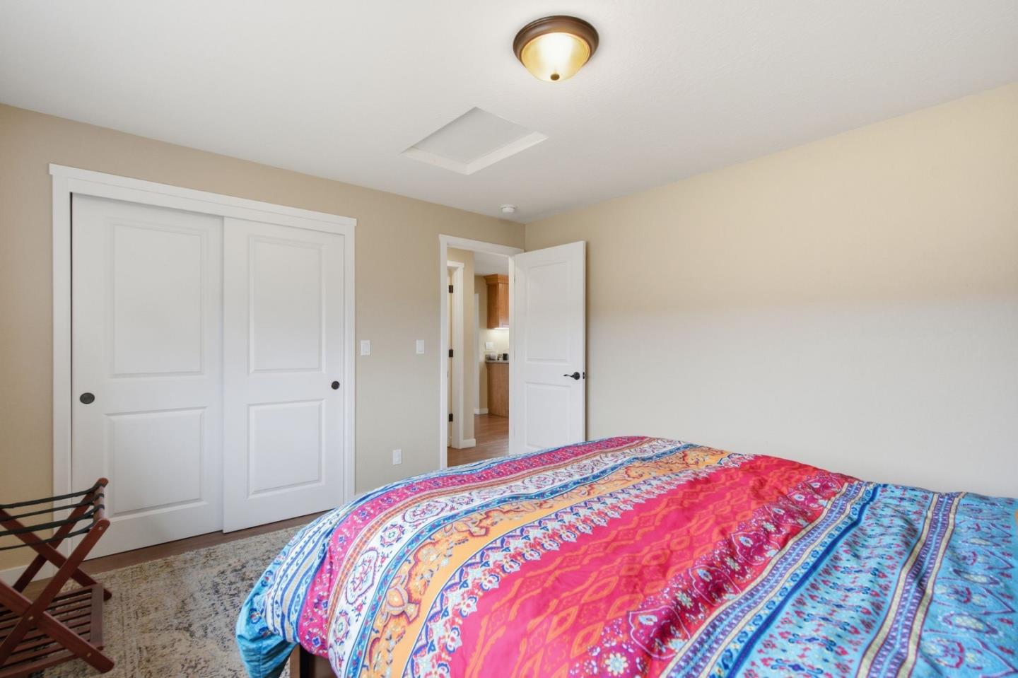 1263 Reservoir Road Pescadero, CA 94060 - Photo 56 of 66 a bedroom with a bed and a closet