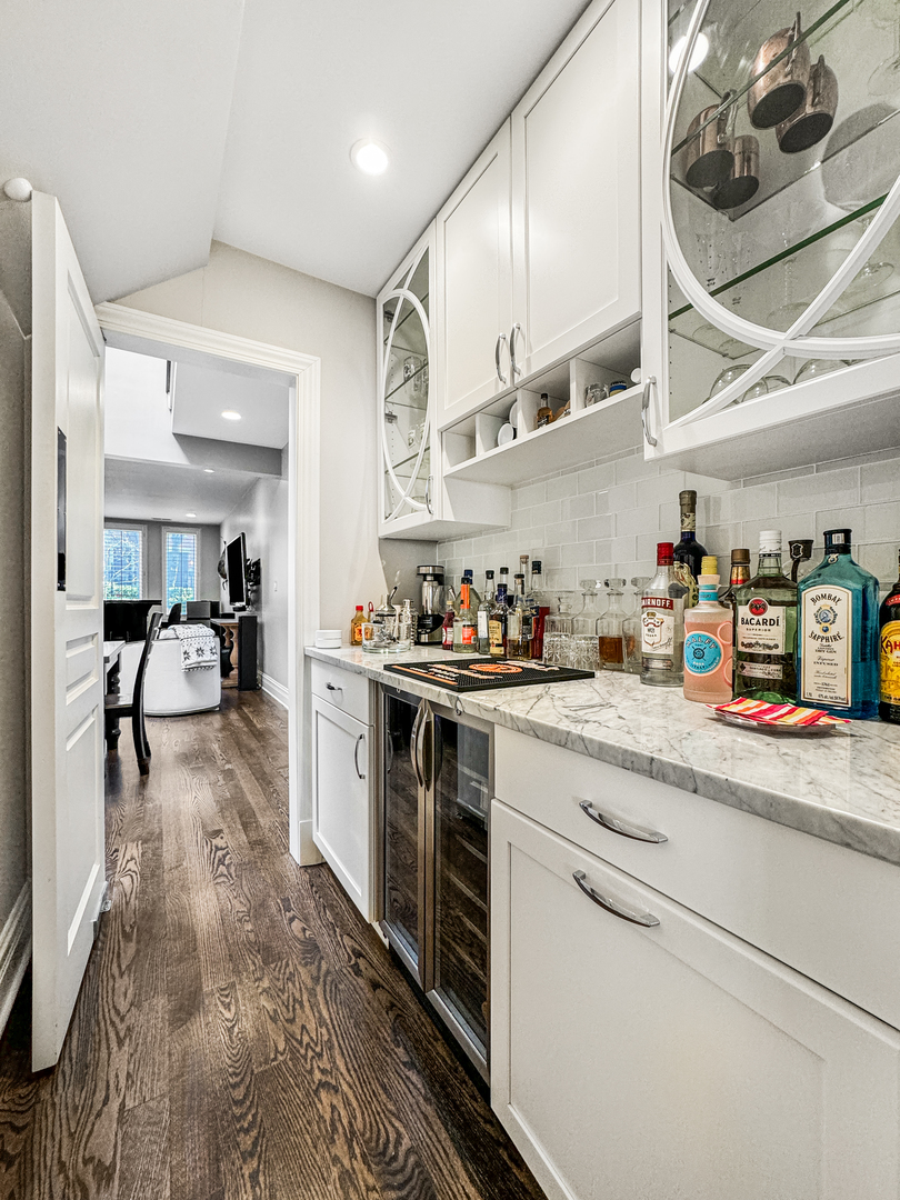2224 North Wayne Avenue Chicago, IL 60614 - Photo 12 of 36 a kitchen with stainless steel appliances granite countertop a sink and cabinets