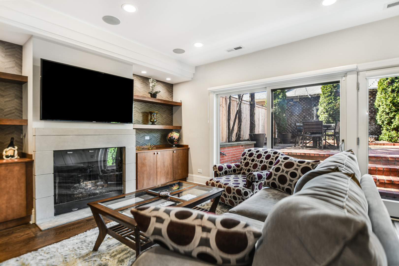 2224 North Wayne Avenue Chicago, IL 60614 - Photo 14 of 36 a living room with furniture a fireplace and a flat screen tv