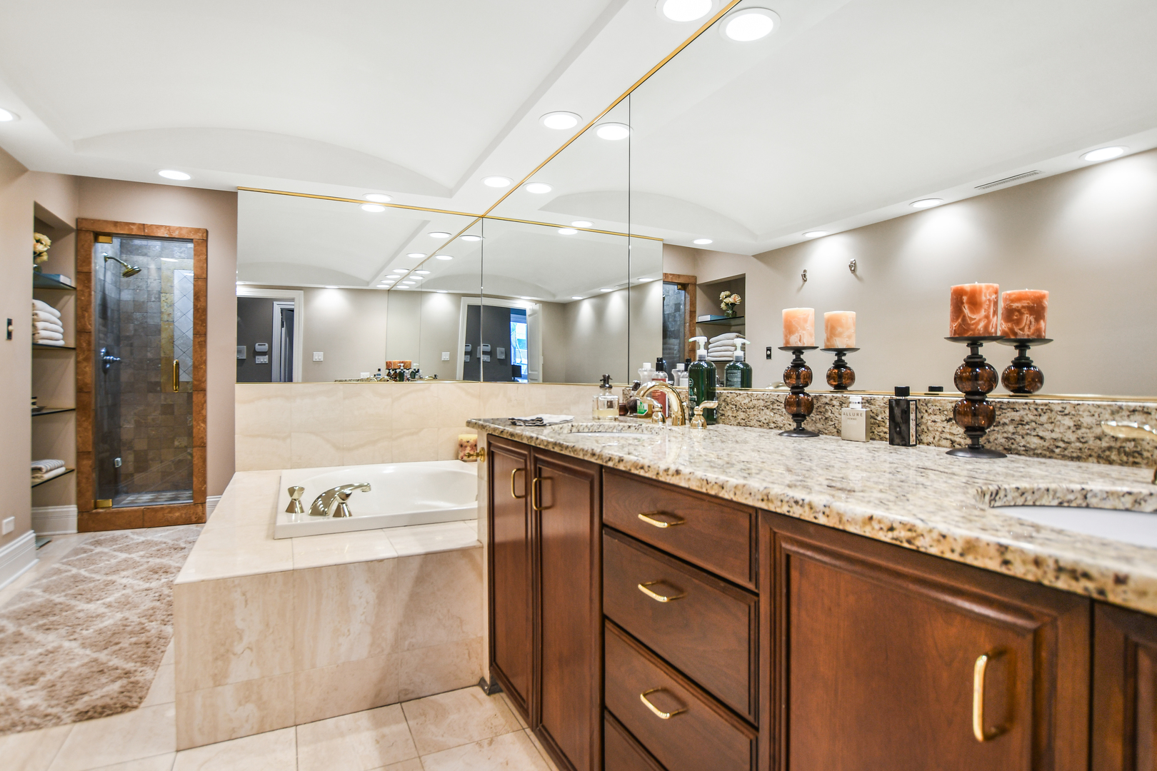 2224 North Wayne Avenue Chicago, IL 60614 - Photo 23 of 36 a spacious bathroom with a granite countertop sink mirror and bathtub