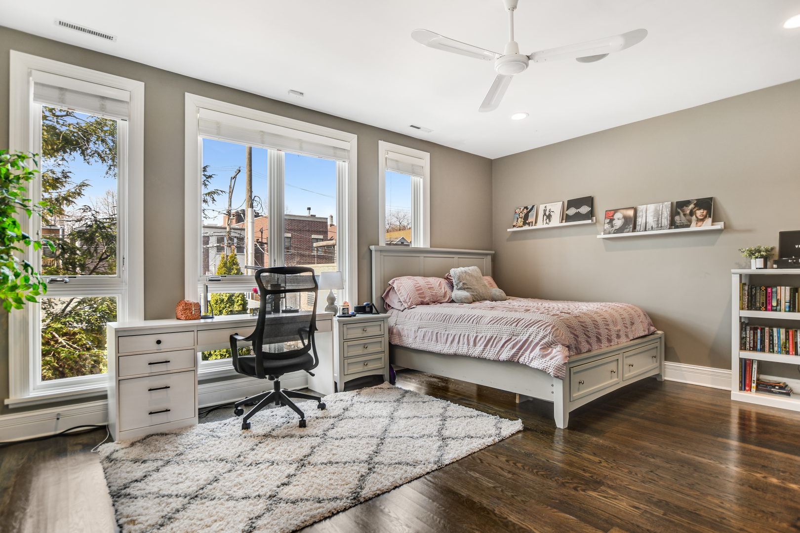 2224 North Wayne Avenue Chicago, IL 60614 - Photo 24 of 36 a bedroom with a bed a bookshelf and a window