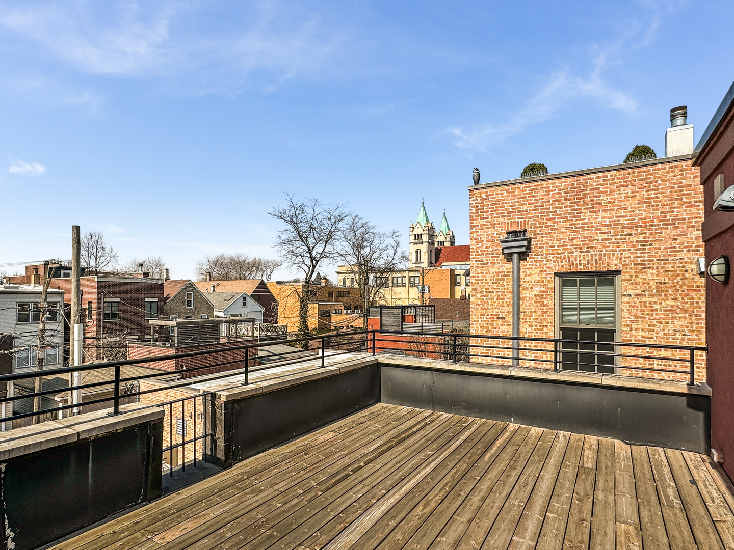 2224 North Wayne Avenue Chicago, IL 60614 - Photo 31 of 36 a view of a balcony with wooden floor and city view