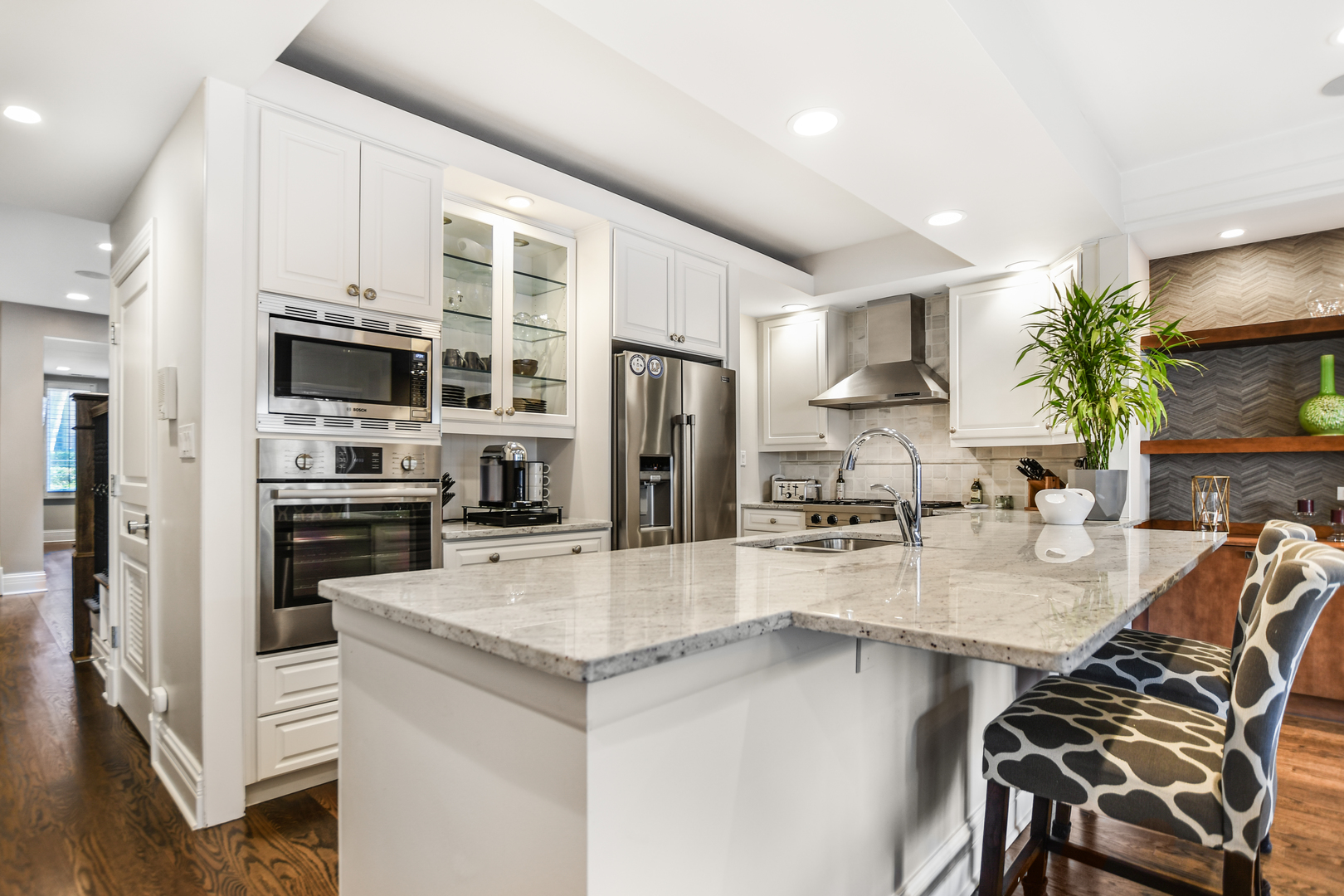2224 North Wayne Avenue Chicago, IL 60614 - Photo 9 of 36 a kitchen with stainless steel appliances granite countertop a stove refrigerator and a sink