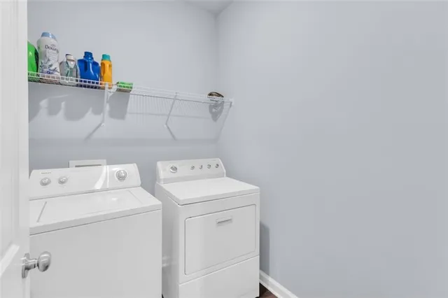 a utility room with dryer and washer