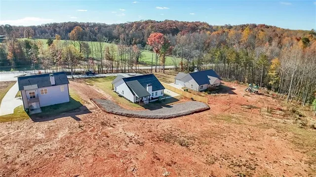 a view of a backyard with sitting area