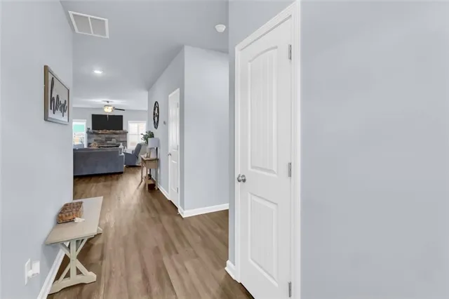 a view of kitchen with furniture and wooden floor