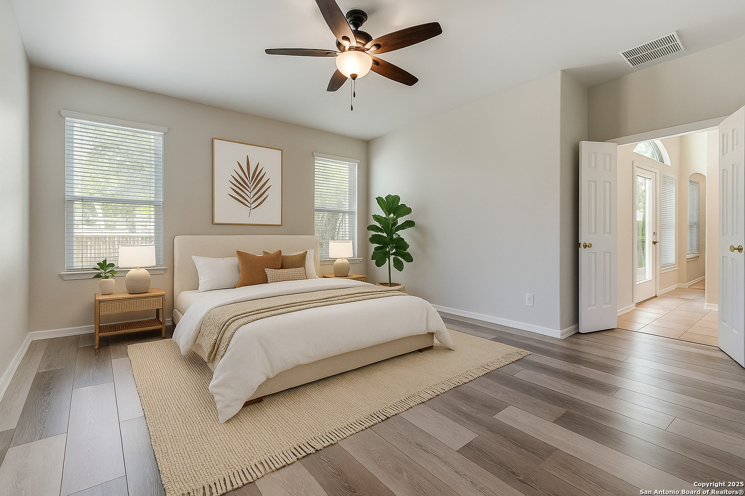 112 Spring Fawn Cibolo, TX 78108 - Photo 15 of 26 a bedroom with a large bed and a chandelier