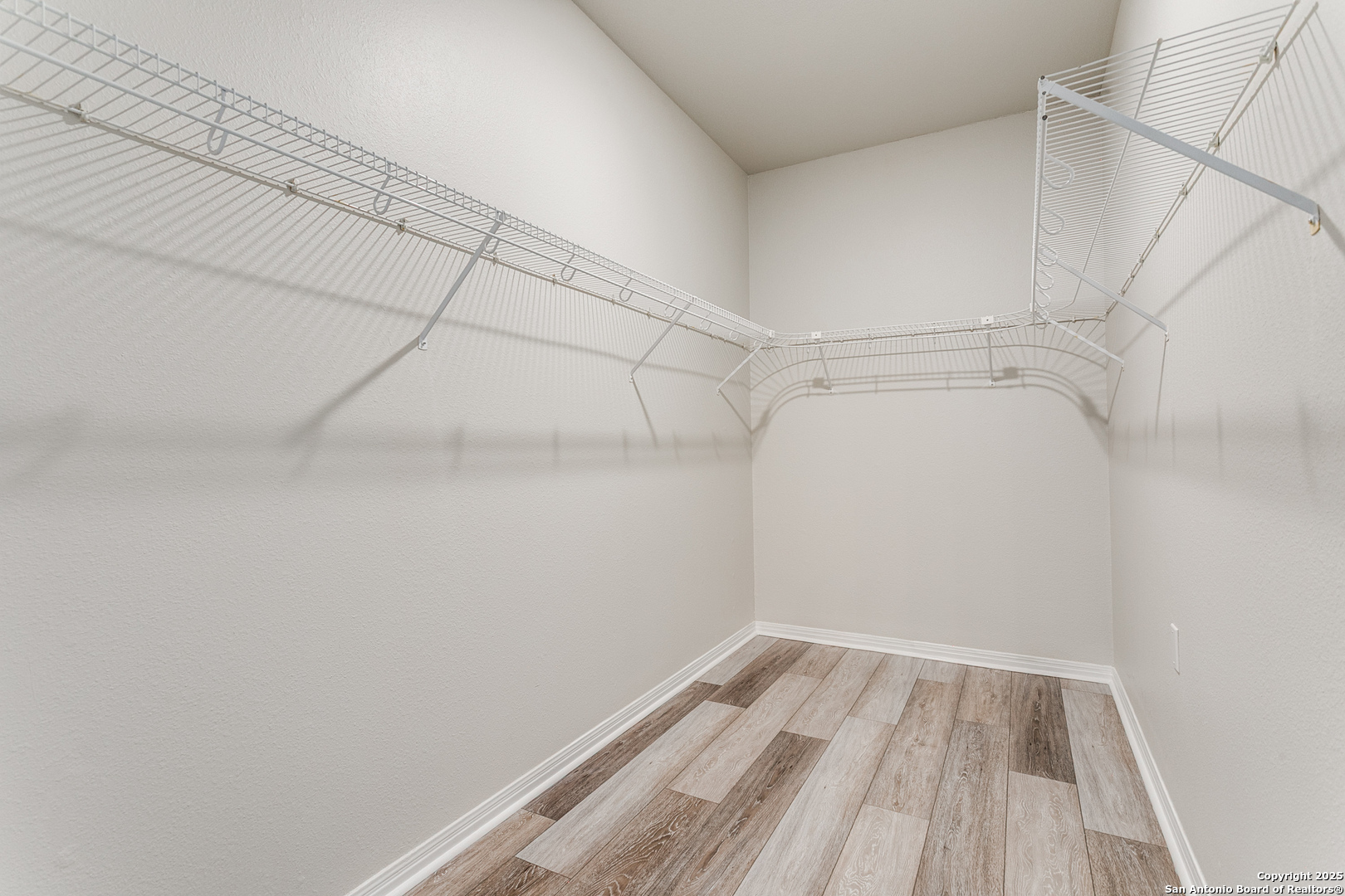 112 Spring Fawn Cibolo, TX 78108 - Photo 19 of 26 a view of a room with racks on the wall